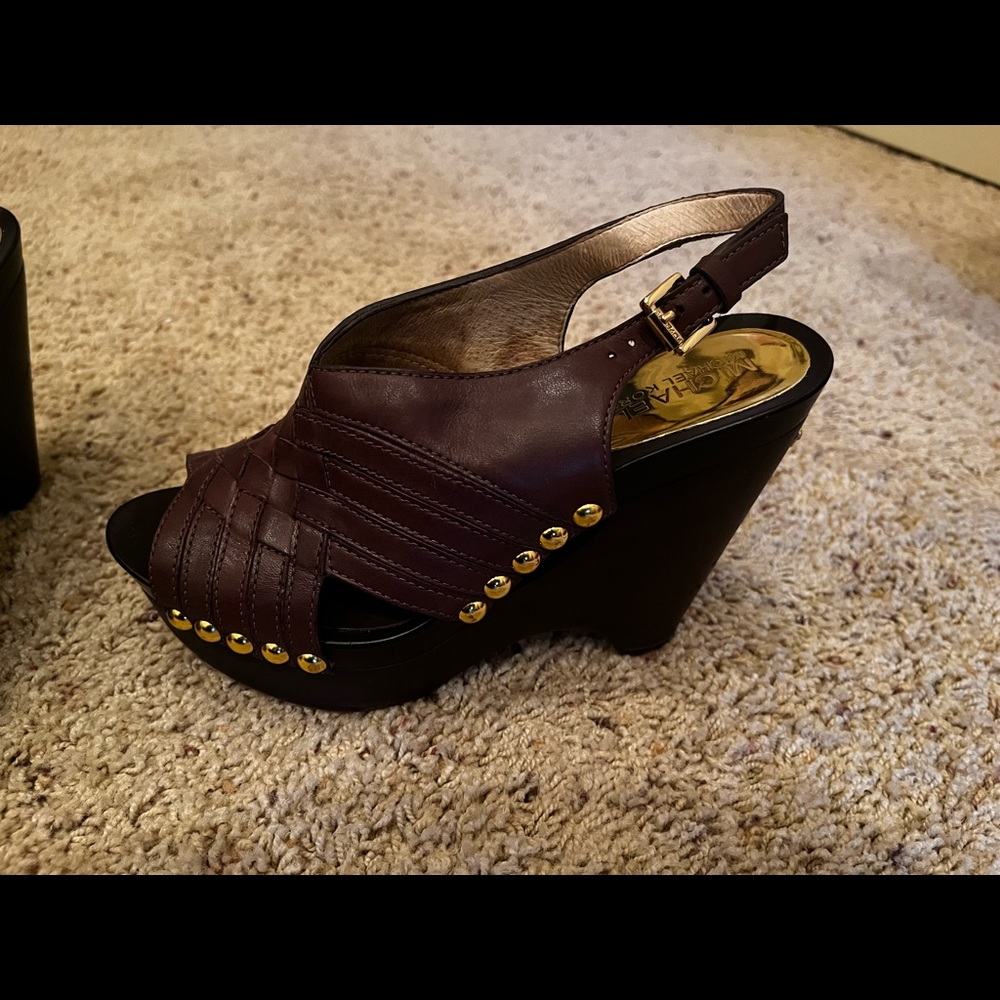 Really cute! Michael Kors brown leather wedge sandals with gold detail. Size 6.